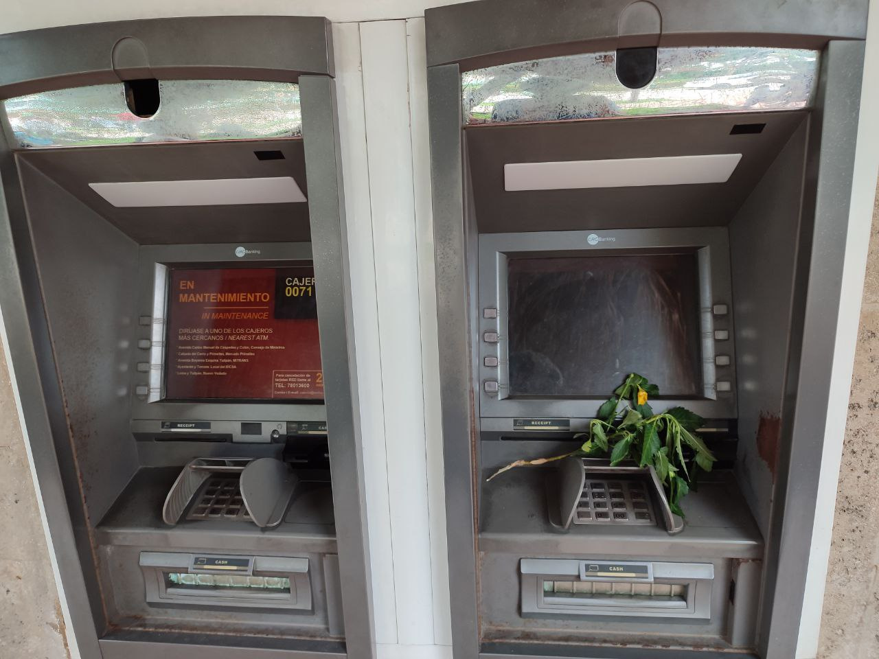 flowers-for-one-of-the-many-defunct-atms-in-cuba