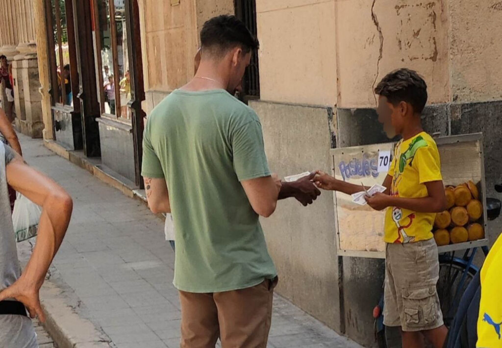 a-boy-asking-for-money-at-the-entrance-to-an-ice-cream-parlor-is-the-new-face-of-havana